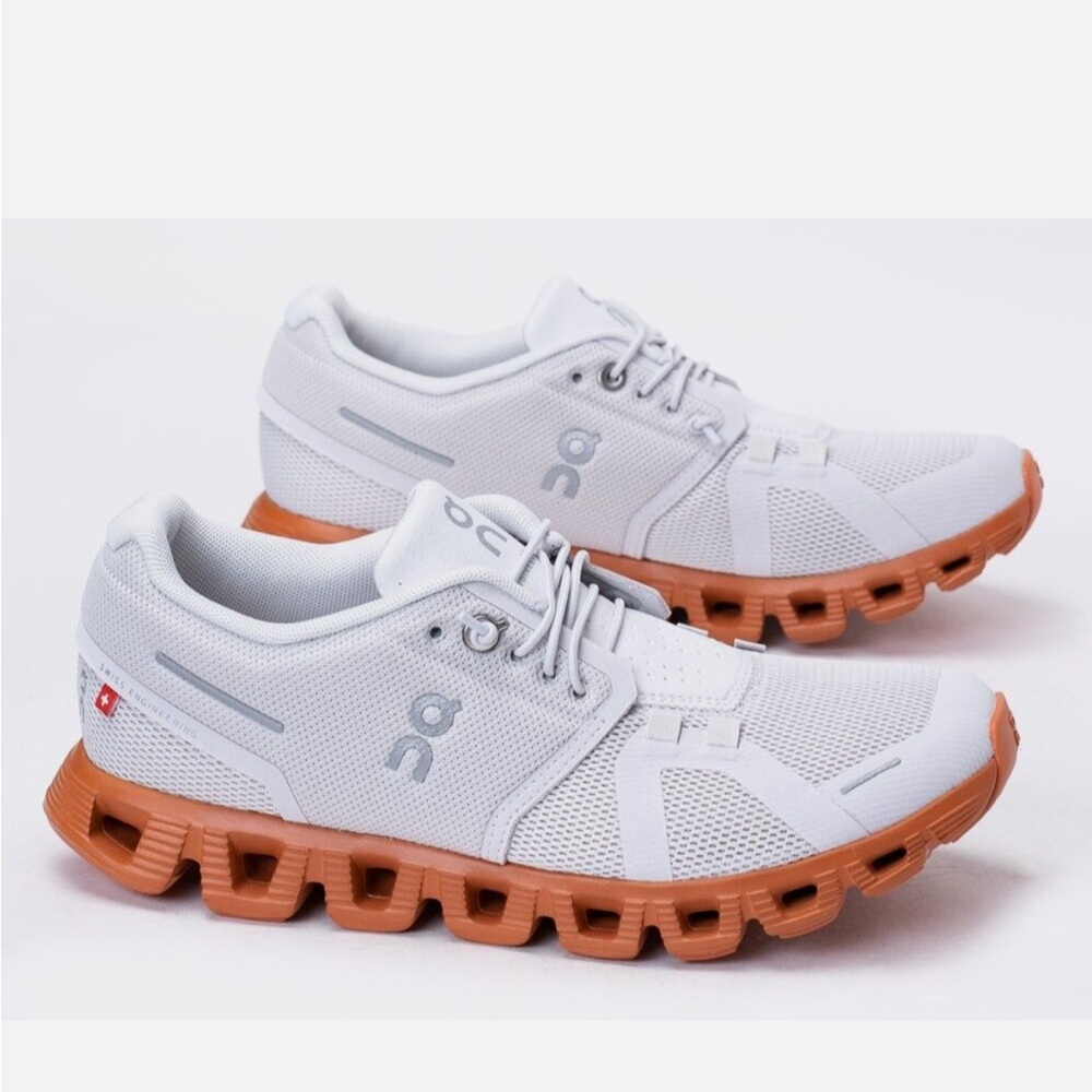 On Running White and Tan Athletic Shoes